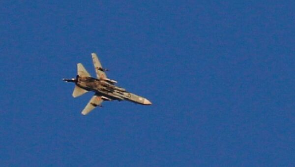 A war jet flies above Syria near the Israeli Syrian border as it is seen from the Israeli-occupied Golan Heights, Israel July 23, 2018 - Sputnik International