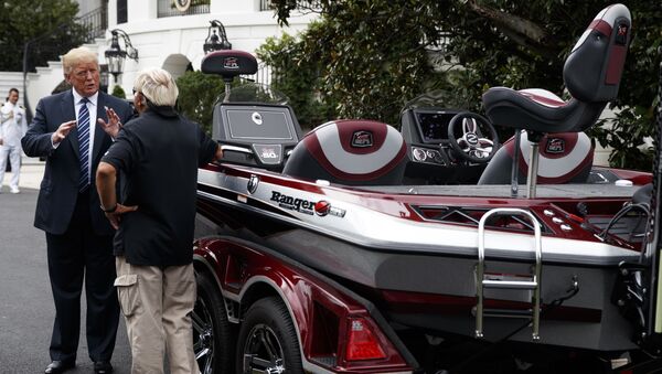 President Donald Trump talks with Jimmy Houston of Ranger Boats as he participates in a tour during a Made in America Product Showcase at the White House, Monday, July 23, 2018, in Washington - Sputnik International