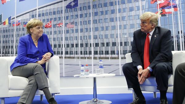 President Donald Trump and German Chancellor Angela Merkel during their bilateral meeting, Wednesday, July 11, 2018 in Brussels, Belgium - Sputnik International