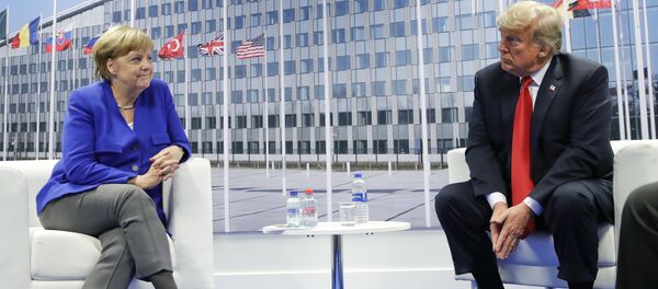 President Donald Trump and German Chancellor Angela Merkel during their bilateral meeting, Wednesday, July 11, 2018 in Brussels, Belgium - Sputnik International