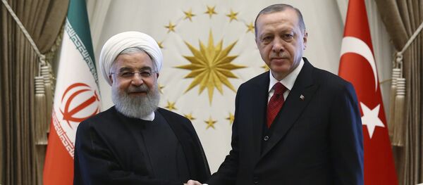 Turkey's President Recep Tayyip Erdogan, right, and Iran's President Hassan Rouhani shake hands before a meeting in Ankara, Turkey, Wednesday, April 4, 2018 - Sputnik International