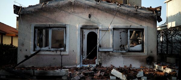 A burnt house is seen following a wildfire at the village of Mati, near Athens, Greece, July 25, 2018 - Sputnik International