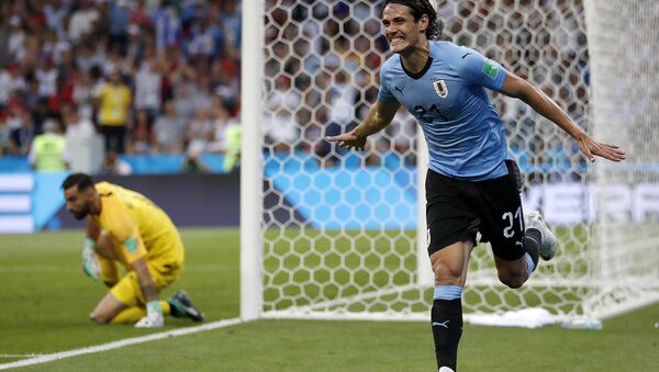 Uruguay's Edinson Cavani celebrates after he scored the opening goal during the round of 16 match between Uruguay and Portugal at the 2018 soccer World Cup at the Fisht Stadium in Sochi, Russia, Saturday, June 30, 2018 - Sputnik International