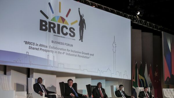 (FromL) Deputy President of South Africa David Mabuza, President of China Xi Jinping, President of the Republic of South Africa Cyril Ramaphosa attend a Business Forum organised during the 10th BRICS (acronym for the grouping of the world's leading emerging economies, namely Brazil, Russia, India, China and South Africa) summit at the Sandton Convention Centre in Johannesburg, South Africa on July 25, 2018 - Sputnik International