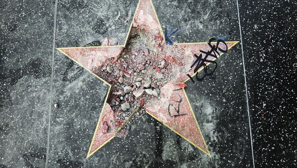 This photo shows Donald Trump's star on the Hollywood Walk of Fame that was vandalized Wednesday, July 25, 2018, in Los Angeles. Los Angeles police Officer Ray Brown said the vandalism was reported early Wednesday and someone was subsequently taken into custody. Authorities said a pickax was used in the vandalism - Sputnik International