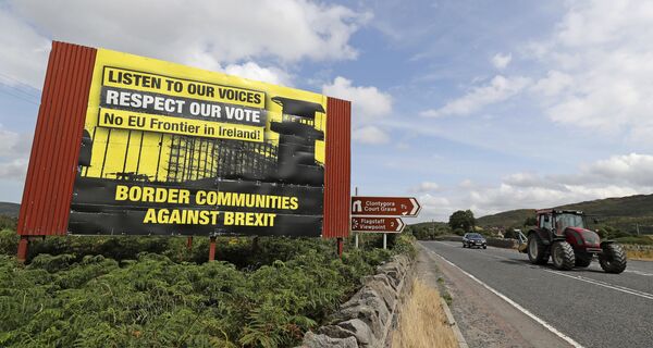 Anti-Brexit billboards are seen on the northern side of the border between Newry, in Northern Ireland, and Dundalk, in the Republic of Ireland, on Wednesday, July 18, 2018. Anti-Brexit billboards are seen on the northern side of the border between Newry, in Northern Ireland, and Dundalk, in the Republic of Ireland, on Wednesday, July 18, 2018. - Sputnik International