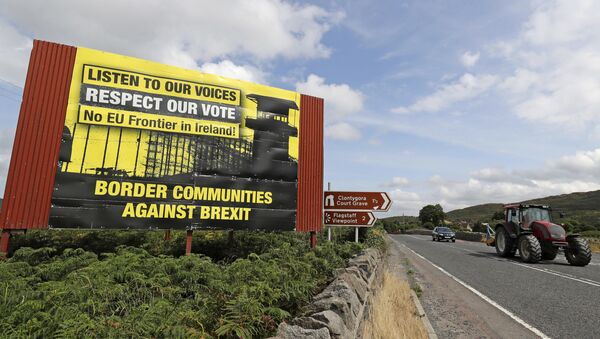 Anti Brexit billboards are seen on the northern side of the border between Newry, in Northern Ireland, and Dundalk, in the Republic of Ireland, on Wednesday, July 18, 2018. British Prime Minister Theresa May is scheduled to make her first visit to the Irish border since the Brexit referendum later this week - Sputnik International
