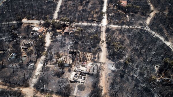 This Wednesday, July 25, 2018 aerial photo shows burnt houses and trees following a wildfire in Mati, east of Athens - Sputnik International