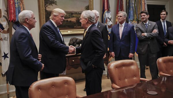 President Donald Trump shakes hands with Senate Majority Leader Mitch McConnell of Ky., center, before the start of a meeting with House and Senate Leadership in the Roosevelt Room of the White House in Washington, Tuesday, June 6, 2017 - Sputnik International