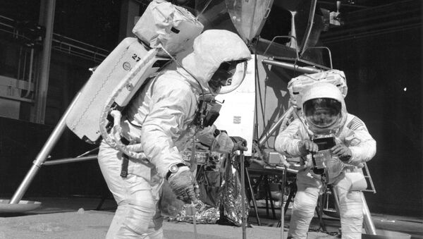 Two members of the Apollo 11 lunar landing mission participate in a simulation of deploying and using lunar tools on the surface of the Moon during a training exercise on April 22, 1969 - Sputnik International