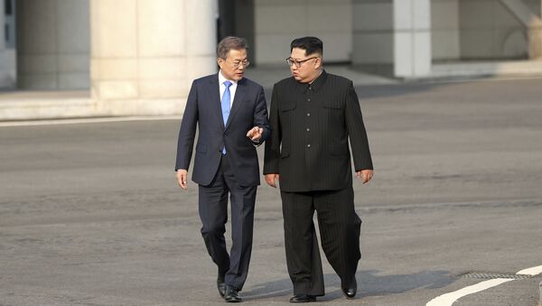 North Korean leader Kim Jong-un, right, talks with South Korean President Moon Jae-in at the border village of Panmunjom in the Demilitarized Zone, South Korea, Friday, April 27, 2018 - Sputnik International