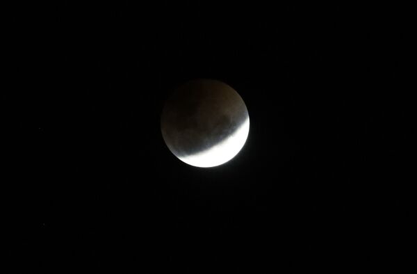 A blood moon rises over Johannesburg, South Africa, Saturday, July 28, 2018. Skywatchers around much of the world are looking forward to a complete lunar eclipse that will be the longest this century. The so-called blood moon Friday, when it turns a deep red, will be visible at different times in Australia, Africa, Asia, Europe and South America when the sun, Earth and moon line up perfectly, casting Earth's shadow on the moon. A blood moon rises over Johannesburg, South Africa, Saturday, July 28, 2018. Skywatchers around much of the world are looking forward to a complete lunar eclipse that will be the longest this century. The so-called blood moon Friday, when it turns a deep red, will be visible at different times in Australia, Africa, Asia, Europe and South America when the sun, Earth and moon line up perfectly, casting Earth's shadow on the moon. - Sputnik International