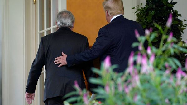 U.S. President Donald Trump and President of the European Commission Jean-Claude Juncker walk together after speaking about trade relations in the Rose Garden of the White House in Washington, U.S., July 25, 2018 - Sputnik International
