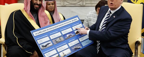 President Donald Trump shows a chart highlighting arms sales to Saudi Arabia during a meeting with Saudi Crown Prince Mohammed bin Salman in the Oval Office of the White House, Tuesday, March 20, 2018, in Washington - Sputnik International