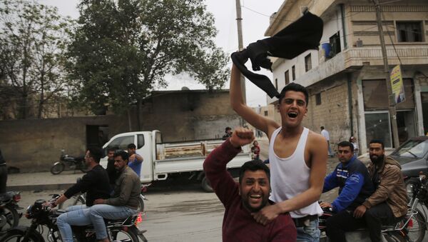 In this photo taken on Wednesday, March 28, 2018, Syrian soccer fans celebrate after their local team won a game, in Manbij, north Syria. Manbij, a mixed Arab and Kurdish town of nearly 400,000, was liberated from Islamic State militants in 2016 by the YPG fighters with backing from U.S-led coalition airstrikes. With Turkey's threats, the town has become the axle for U.S. policy in Syria, threatening its prestige and military deployment in eastern Syria - Sputnik International