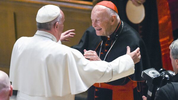 In this Sept. 23, 2015 file photo, Pope Francis reaches out to hug Cardinal Archbishop emeritus Theodore McCarrick after the Midday Prayer of the Divine with more than 300 U.S. Bishops at the Cathedral of St. Matthew the Apostle in Washington. Pope Francis has accepted U.S. prelate Theodore McCarrick's offer to resign from the College of Cardinals following allegations of sexual abuse, including one involving an 11-year-old boy, and ordered him to conduct a life of prayer and penance in a home to be designated by the pontiff until a church trial is held, the Vatican said Saturday - Sputnik International