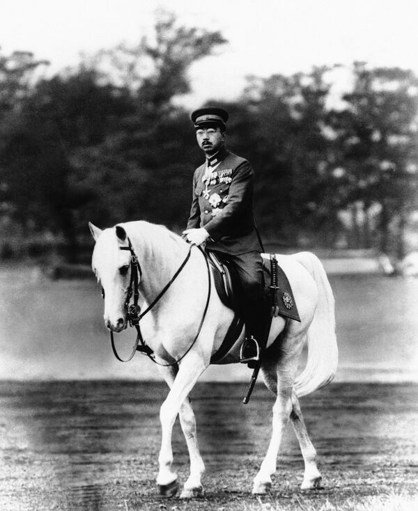 In this undated file photo, Japan's Emperor Hirohito rides a horse at the imperial palace in 1940. A newly released memo by a wartime Japanese official provides what a historian says is the first look at what was on the minds of Emperor Hirohito and Prime Minister Hideki Tojo on the eve of the fateful 1941 attach on Pearl Harbor that thrust the U.S. into World War II. - Sputnik International