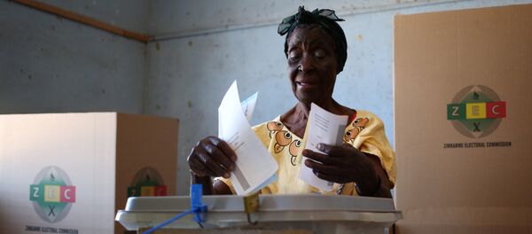 A woman casts her ballot in the country's general elections in Harare, Zimbabwe, July 30, 2018 A woman casts her ballot in the country's general elections in Harare, Zimbabwe, July 30, 2018 - Sputnik International