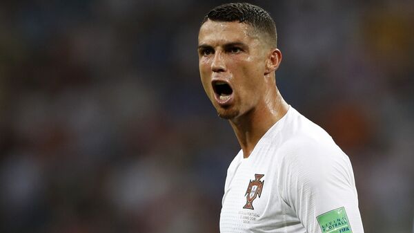 In this file photo dated Saturday, June 30, 2018, Portugal's Cristiano Ronaldo reacts during the round of 16 match between Uruguay and Portugal during the 2018 soccer World Cup at the Fisht Stadium in Sochi, Russia. Cristiano Ronaldo is leaving Real Madrid it is announced Tuesday July 10, 2018, to join Italian club Juventus, bringing to an end a hugely successful nine-year spell in Spain - Sputnik International