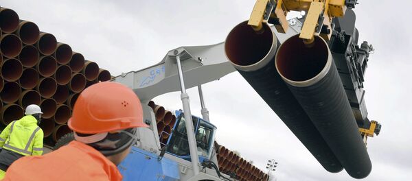 In this May 8, 2017 photo steel pipes for the North Stream 2 pipeline are uploaded in Mukran harbour in Sassnitz, Germany In this May 8, 2017 photo steel pipes for the North Stream 2 pipeline are uploaded in Mukran harbour in Sassnitz, Germany - Sputnik International
