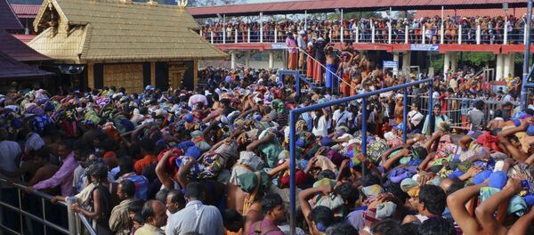 In this Dec. 1, 2015 photo, Hindu worshippers queue during a pilgrimage at the Sabarimala temple in the southern Indian state of Kerala In this Dec. 1, 2015 photo, Hindu worshippers queue during a pilgrimage at the Sabarimala temple in the southern Indian state of Kerala - Sputnik International