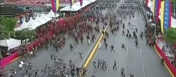 Venezuelan National Guard soldiers run during an event which was interrupted, in this still frame taken from video August 4, 2018, Caracas, Venezuela. Venezuelan National Guard soldiers run during an event which was interrupted, in this still frame taken from video August 4, 2018, Caracas, Venezuela. - Sputnik International