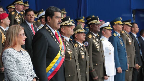 El presidente de Venezuela, Nicolás Maduro, y su esposa, Cilia Flores, asisten a un evento militar en Caracas, Venezuela, el 4 de agosto de 2018. - Sputnik International