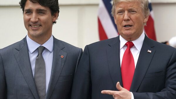 President Donald Trump and Canadian Prime Minister Justin Trudeau pose for a photo as Trudeau arrives at the White House in Washington, Wednesday, Oct. 11, 2017 - Sputnik International