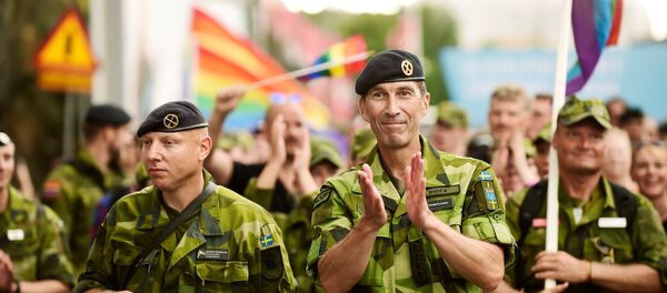 Supreme Commander of the Swedish Armed Forces Micael Byden with other members of the Armed Forces participate in Saturday's EuroPride Parade in Stockholm, Sweden August 4, 2018 - Sputnik International
