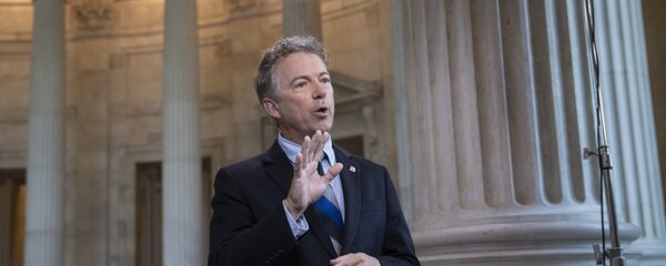 During a TV news interview, Sen. Rand Paul, R-Ky., defends President Donald Trump and his Helsinki news conference with Russian President Vladimir Putin whereTrump appeared to cast doubt on U.S. intelligence findings that Russia interfered in the 2016 election, on Capitol Hill in Washington, Tuesday, July 17, 2018 - Sputnik International