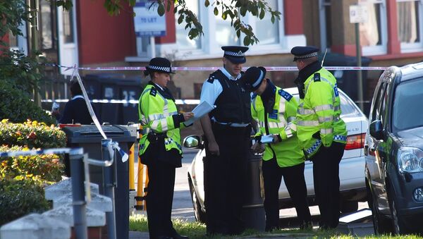 Police officers at the scene of the assassination of Pakistani exiled politician Imran Farooq in London in 2010 - Sputnik International