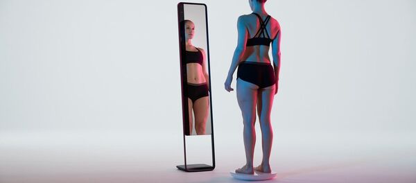 Some experts have raised concerns that hackers could access the revealing images taken by the mirrors, but Naked Labs says all the data it stores is safely encrypted and detached from customer names Some experts have raised concerns that hackers could access the revealing images taken by the mirrors, but Naked Labs says all the data it stores is safely encrypted and detached from customer names - Sputnik International