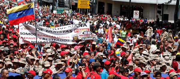 Militia members and supporters of Venezuela's President Nicolas Maduro attend a rally in support of him in Caracas, Venezuela August 6, 2018. - Sputnik International