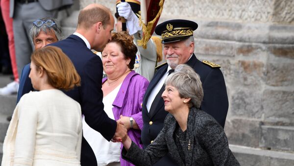 Britain's Prince William (2L) shakes hands with Britain's Prime Minister Theresa May in Amiens, northern France on August 8, 2018, as he arrives to attend a ceremony to mark the 100th anniversary of the World War I Battle of Amiens - Sputnik International