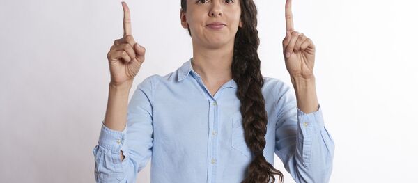 A woman lifting her arms A woman lifting her arms - Sputnik International