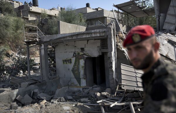 A Palestinian Hamas military policeman inspects the damage caused by Israeli airstrikes in Gaza City, Thursday, Aug. 9, 2018. Israel struck targets in the Gaza Strip after dozens of rockets were launched Wednesday from the coastal territory ruled by the Islamic militant Hamas group, the Israeli military said A Palestinian Hamas military policeman inspects the damage caused by Israeli airstrikes in Gaza City, Thursday, Aug. 9, 2018. Israel struck targets in the Gaza Strip after dozens of rockets were launched Wednesday from the coastal territory ruled by the Islamic militant Hamas group, the Israeli military said - Sputnik International