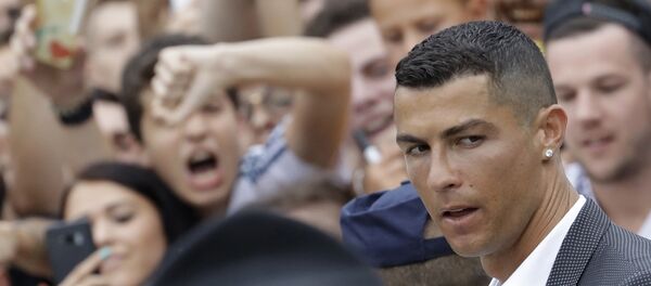 Portuguese ace Ronaldo passes among enthusiast fans as he arrives to undergo medical checks at the Juventus stadium in Turin, Italy, Monday, July 16, 2018 Portuguese ace Ronaldo passes among enthusiast fans as he arrives to undergo medical checks at the Juventus stadium in Turin, Italy, Monday, July 16, 2018 - Sputnik International