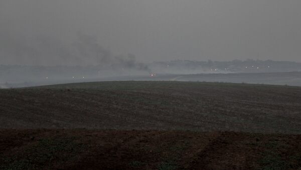 A distant shot of fires burning outside Gaza. - Sputnik International