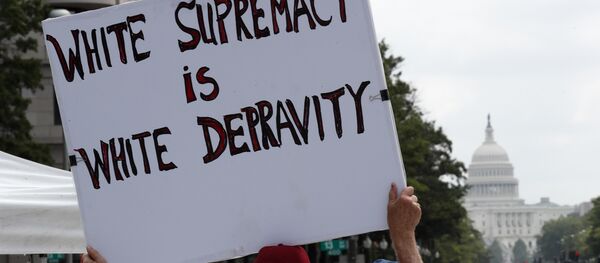 Groups protest in Freedom Plaza with the U.S. Capitol in the background, on the one year anniversary of Charlottesville's deadly Unite the Right rally, Sunday, Aug. 12, 2018, in Washington. - Sputnik International
