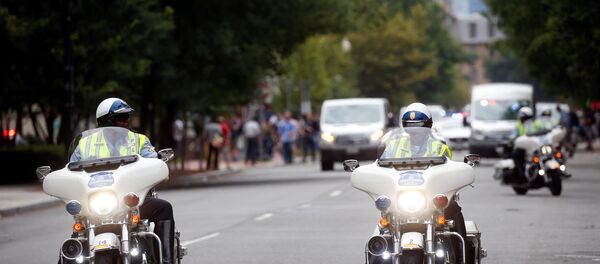 Police on motorcycles are pictured near a protest against the white nationalist-led Unite the Right rally held in front of the White House on the one-year anniversary of the white nationalist-led rally in Charlottesville, VA, in downtown Washington, U.S., August 12, 2018. Police on motorcycles are pictured near a protest against the white nationalist-led Unite the Right rally held in front of the White House on the one-year anniversary of the white nationalist-led rally in Charlottesville, VA, in downtown Washington, U.S., August 12, 2018. - Sputnik International