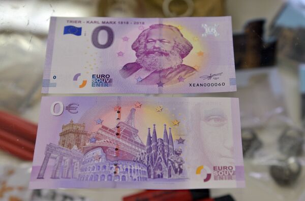 This picture taken on April, 10, 2018 in Trier, southwestern Germany, shows the front and the back side of a Zero-Euro-bank note realeased on the occasion of German philosopher Karl Marx's bicentenary This picture taken on April, 10, 2018 in Trier, southwestern Germany, shows the front and the back side of a Zero-Euro-bank note realeased on the occasion of German philosopher Karl Marx's bicentenary - Sputnik International