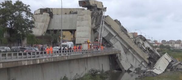 Rescue workers are seen at the collapsed Morandi Bridge in the Italian port city of Genoa, Italy August 14, 2018 in this still image taken from a video Rescue workers are seen at the collapsed Morandi Bridge in the Italian port city of Genoa, Italy August 14, 2018 in this still image taken from a video - Sputnik International