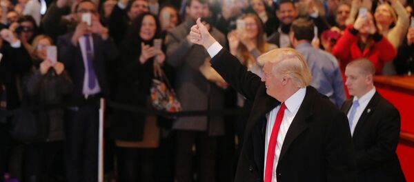 U.S. President elect Donald Trump reacts to a crowd gathered in the lobby of the New York Times building after a meeting in New York U.S. President elect Donald Trump reacts to a crowd gathered in the lobby of the New York Times building after a meeting in New York - Sputnik International