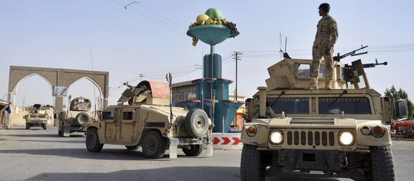 In this Sunday, Aug. 12, 2018, photo, Afghan security personnel patrol in the city of Ghazni province west of Kabul, Afghanistan. In this Sunday, Aug. 12, 2018, photo, Afghan security personnel patrol in the city of Ghazni province west of Kabul, Afghanistan. - Sputnik International