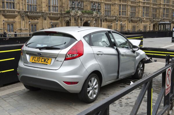 The car that was driven at pedestrians and cyclists in Westminster then crashed into the barrier outside the Houses of Parliament on Tuesday is seen in an image handed out by the Metropolitan Police in London, August 15, 2018 The car that was driven at pedestrians and cyclists in Westminster then crashed into the barrier outside the Houses of Parliament on Tuesday is seen in an image handed out by the Metropolitan Police in London, August 15, 2018 - Sputnik International