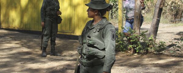 Venezuelan Bolivarian soldiers stand at a checkpoint near Urena, Tachira state, Venezuela, on the border with Colombia. Venezuelan Bolivarian soldiers stand at a checkpoint near Urena, Tachira state, Venezuela, on the border with Colombia. - Sputnik International