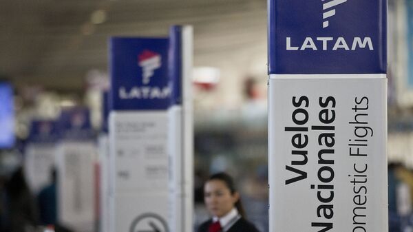An agent of LATAM airlines stands by the counters at the airport in Santiago, Chile, Monday, July 25, 2016. - Sputnik International
