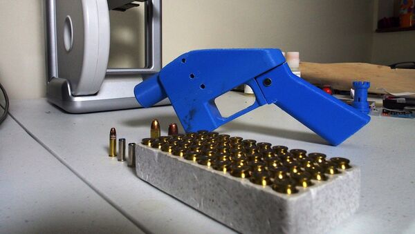 a Liberator pistol appears next to the 3D printer on which its components were made. - Sputnik International