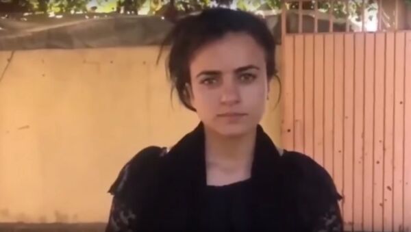 Yazidi refugee Ashwaq Ta'lo told Sputnik that she decided to return to Iraq from Germany after twice encountering her former Daesh captor there - Sputnik International