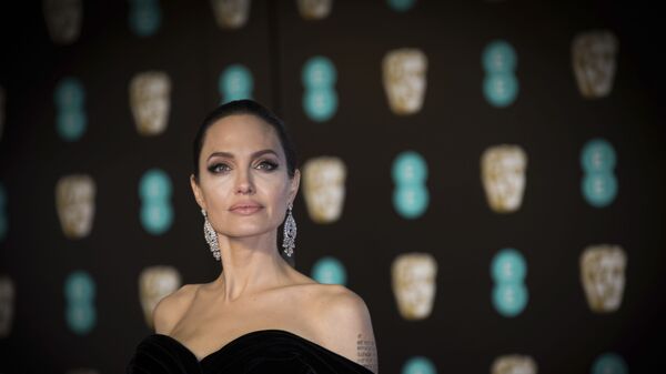 Angelina Jolie poses for photographers upon arrival at the BAFTA Film Awards, in London, Sunday, 18 February 2018.  - Sputnik International